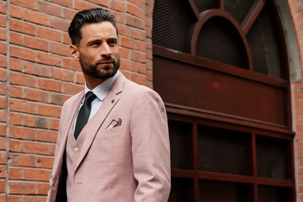 A man wearing a pink V2 Classic suit in support of Beat Breast Cancer
